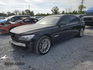 2014 BMW 7 Series 740Li with VIN WBAYE4C52ED138770, listed as a Copart auction lot 53647665 with 106,827 mi miles and Salvage title. Bid and sale history available at DreamBid. Image 1.