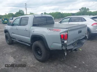 2021 Toyota Tacoma SR with VIN 5TFCZ5AN3MX258746, listed as a IAAI auction lot 42252967 with 62,095 mi miles and . Bid and sale history available at DreamBid. Image 3.