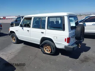 1990 Mitsubishi Montero z VIN JA4GJ31S0LJ009870, wystawiony jako IAAI lot #42192378 z przebiegiem 200 028 mil mil oraz . Historia ofert i sprzedaży dostępna na DreamBid. Obrazek 3.