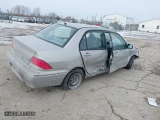 2002 Mitsubishi Lancer ES with VIN JA3AJ26E62U043039, listed as a IAAI auction lot 41600217 with 141,217 mi miles. Bid and sale history available at carsss.com. Image 4.