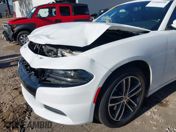 2019 Dodge Charger SXT with VIN 2C3CDXJGXKH533322, listed as a IAAI auction lot 41808838 with 95,877 mi miles and . Bid and sale history available at DreamBid. Image 6.