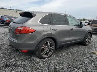 2011 Porsche Cayenne S with VIN WP1AB2A2XBLA55565, listed as a Copart auction lot 63094305 with 105,250 mi miles and Salvage title. Bid and sale history available at DreamBid. Image 3.