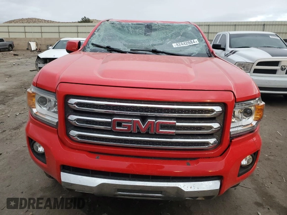 2015 GMC Canyon 4WD SLE with VIN 1GTG6BE30F1136918, listed as a Copart auction lot 82442884 with 102,361 mi miles and Salvage Title. Bid and sale history available at carsss.com. Image 5.