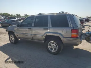 1998 Jeep Grand Cherokee Limited with VIN 1J4GZ78S5WC325148, listed as a Copart auction lot 67780424 with 0 mi miles and Salvage Title. Bid and sale history available at carsss.com. Image 2.