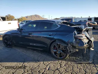 2023 Genesis G70 3.3T with VIN KMTG54TE1PU106881, listed as a Copart auction lot 83988384 with 70,698 mi miles and Salvage Title. Bid and sale history available at DreamBid. Image 2.