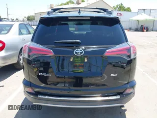 2018 Toyota RAV4 XLE with VIN 2T3WFREV2JW447623, listed as a IAAI auction lot 42410168 with 84,800 mi miles and . Bid and sale history available at DreamBid. Image 16.