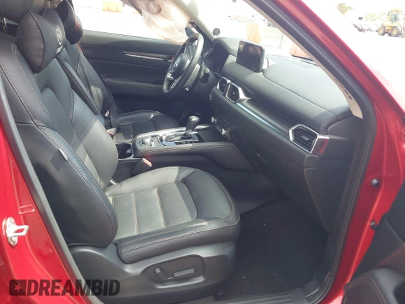 2021 Mazda CX-5 Grand Touring with VIN JM3KFADM6M1373111, listed as a IAAI auction lot 42784431 with 14,374 mi miles and . Bid and sale history available at DreamBid. Image 5.