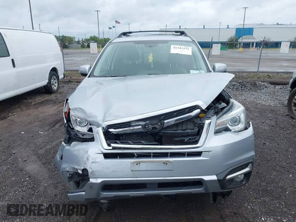 2018 Subaru Forester Touring with VIN JF2SJAWC6JH496875, listed as a IAAI auction lot 42347532 with 70,978 mi miles and . Bid and sale history available at DreamBid. Image 12.