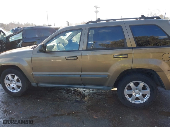 2009 Jeep Grand Cherokee Laredo with VIN 1J8GS48K79C516320, listed as a IAAI auction lot 41353131 with 166,739 mi miles. Bid and sale history available at carsss.com. Image 14.