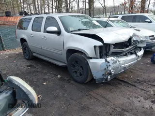2014 Chevrolet Suburban LT with VIN 1GNSKJE73ER225733, listed as a IAAI auction lot 41641078 with 240,320 mi miles and . Bid and sale history available at DreamBid. Image 1.