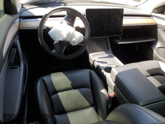 2023 Tesla Model 3 with VIN 5YJ3E1EA9PF401418, listed as a Copart auction lot 50597015 with 79,673 mi miles and Salvage Title. Bid and sale history available at DreamBid. Image 8.
