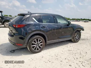 2018 Mazda CX-5 Grand Touring with VIN JM3KFBDM6J0414523, listed as a Copart auction lot 57581145 with 69,353 mi miles and Salvage title. Bid and sale history available at DreamBid. Image 3.