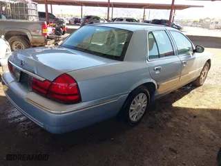 2004 Mercury Grand Marquis GS with VIN 2MEFM74W24X690149, listed as a IAAI auction lot 41842464 with 118,776 mi miles. Bid and sale history available at carsss.com. Image 4.