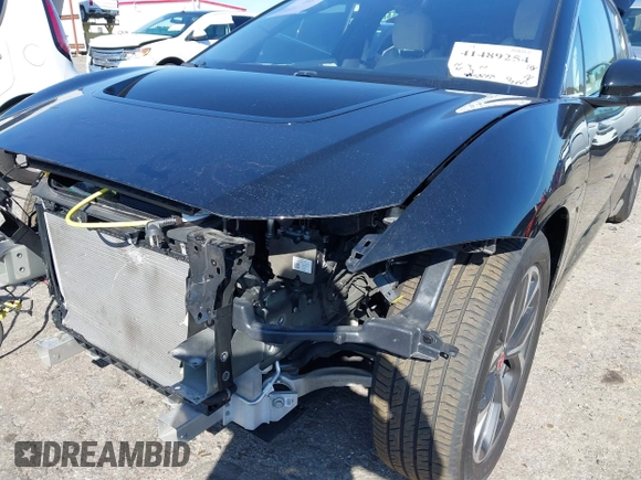2020 Jaguar I-Pace SE with VIN SADHC2S12L1F87240, listed as a IAAI auction lot 41489254 with 58,359 mi miles and . Bid and sale history available at DreamBid. Image 6.