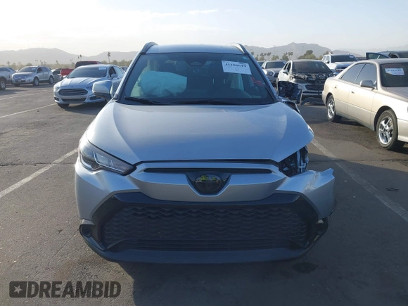 2023 Toyota Corolla Cross Hybrid S with VIN 7MUFBABG8PV011345, listed as a IAAI auction lot 41286619 with 13,518 mi miles and . Bid and sale history available at DreamBid. Image 12.