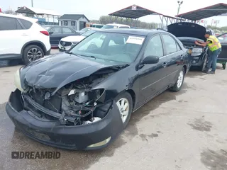 2004 Toyota Camry LE with VIN 4T1BF30K34U080477, listed as a IAAI auction lot 41956998 with 135,441 mi miles. Bid and sale history available at carsss.com. Image 17.