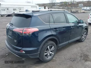 2018 Toyota RAV4 XLE with VIN 2T3RFREV9JW746782, listed as a IAAI auction lot 42065755 with 61,219 mi miles. Bid and sale history available at carsss.com. Image 4.