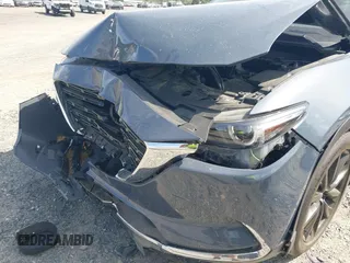 2022 Mazda CX-9 Grand Touring with VIN JM3TCBDY8N0628886, listed as a IAAI auction lot 42074044 with 67,867 mi miles and . Bid and sale history available at DreamBid. Image 6.
