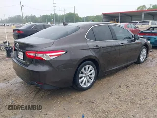 2020 Toyota Camry LE with VIN 4T1C11AK1LU320677, listed as a IAAI auction lot 41914421 with 94,291 mi miles. Bid and sale history available at carsss.com. Image 4.
