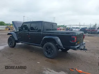 2023 Jeep Gladiator Overland with VIN 1C6JJTFM9PL593659, listed as a IAAI auction lot 42470253 with 34,374 mi miles and . Bid and sale history available at DreamBid. Image 3.