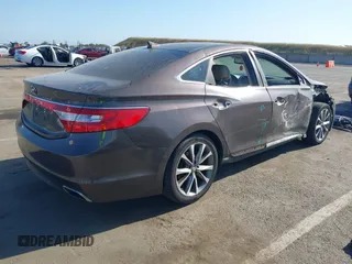 2015 Hyundai Azera with VIN KMHFG4JGXFA439603, listed as a IAAI auction lot 42157274 with 135,990 mi miles and . Bid and sale history available at carsss.com. Image 4.