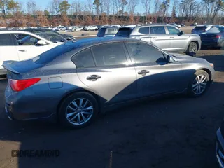 2015 Infiniti Q50 Premium z VIN JN1BV7AR2FM423666, wystawiony jako IAAI lot #41345228 z przebiegiem 67 027 mil mil oraz . Historia ofert i sprzedaży dostępna na DreamBid. Obrazek 13.