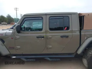 2020 Jeep Gladiator Rubicon z VIN 1C6JJTBG6LL179541, wystawiony jako IAAI lot #42050510 z przebiegiem 52 784 mil mil oraz . Historia ofert i sprzedaży dostępna na DreamBid. Obrazek 13.
