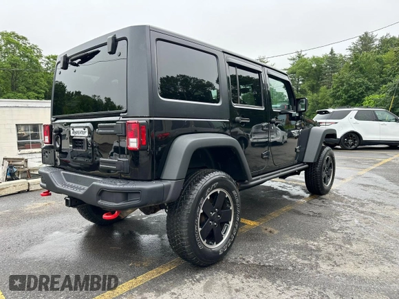 2015 Jeep Wrangler Unlimited Rubicon z VIN 1C4BJWFG2FL541572, wystawiony jako Copart lot #61723875 z przebiegiem 163 169 mil mil oraz Czysty tytuł • Clean title. Historia ofert i sprzedaży dostępna na DreamBid. Obrazek 3.