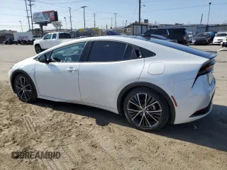 2024 Toyota Prius LE z VIN JTDACAAU7R3016159, wystawiony jako Copart lot #57879835 z przebiegiem 22 184 mil mil oraz Szkoda całkowita • Salvage title. Historia ofert i sprzedaży dostępna na DreamBid. Obrazek 2.