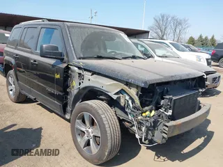 2016 Jeep Patriot High Altitude Edition with VIN 1C4NJRFB7GD596890, listed as a IAAI auction lot 41754038 with 99,971 mi miles. Bid and sale history available at carsss.com. Image 1.
