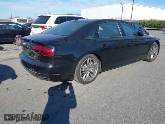 2017 Audi A8 with VIN WAU44AFD0HN017821, listed as a IAAI auction lot 41676097 with 107,378 mi miles and . Bid and sale history available at DreamBid. Image 4.