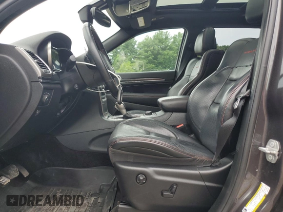 2018 Jeep Grand Cherokee Trailhawk with VIN 1C4RJFLG1JC264781, listed as a Copart auction lot 61524135 with 82,786 mi miles and Salvage title. Bid and sale history available at DreamBid. Image 7.