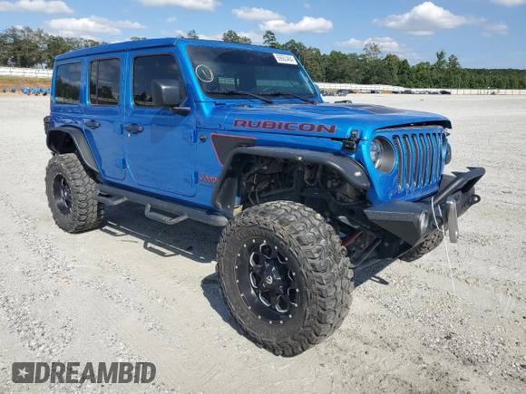 2023 Jeep Wrangler Rubicon with VIN 1C4HJXFN5PW504658, listed as a Copart auction lot 69063484 with 32,490 mi miles and Salvage title. Bid and sale history available at DreamBid. Image 4.