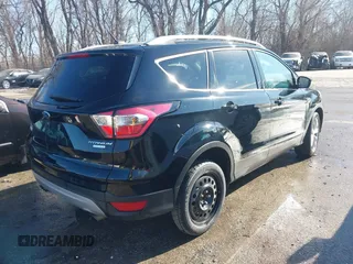 2017 Ford Escape Titanium with VIN 1FMCU0J94HUD58815, listed as a IAAI auction lot 41455415 with 80,421 mi miles and . Bid and sale history available at DreamBid. Image 4.
