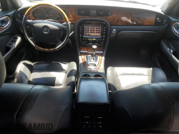 2004 Jaguar XJ с VIN SAJEA73B34TG10749, выставлен на аукционе Copart как лот 56574025 с пробегом 72 240 миль миль и Списание • Salvage title. История ставок и продаж доступна на DreamBid. Изображение 8.