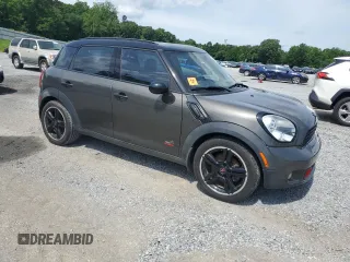 2012 MINI Countryman S with VIN WMWZC5C5XCWL56232, listed as a Copart auction lot 60298705 with 140,425 mi miles and Salvage title. Bid and sale history available at DreamBid. Image 4.