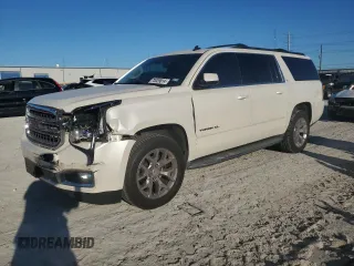 2015 GMC Yukon XL SLT with VIN 1GKS1HKC6FR166415, listed as a Copart auction lot 73029014 with 105,209 mi miles and Salvage Title. Bid and sale history available at carsss.com. Image 1.