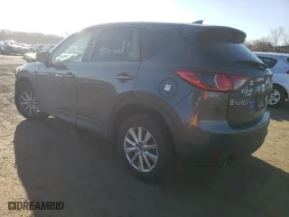 2016 Mazda CX-5 Touring with VIN JM3KE4CY7G0815137, listed as a Copart auction lot 50444665 with 61,681 mi miles and Salvage Title. Bid and sale history available at carsss.com. Image 2.