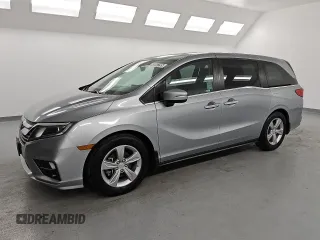 2018 Honda Odyssey EX-L z VIN 5FNRL6H78JB079617, wystawiony jako Copart lot #55087295 z przebiegiem 185 534 mil mil oraz Czysty tytuł • Clean title. Historia ofert i sprzedaży dostępna na DreamBid. Obrazek 1.
