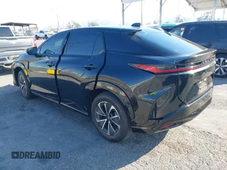 2024 Lexus RZ 300e Premium z VIN JTJABABB1RA004615, wystawiony jako IAAI lot #41310232 z przebiegiem 9 622 mil mil oraz . Historia ofert i sprzedaży dostępna na DreamBid. Obrazek 3.