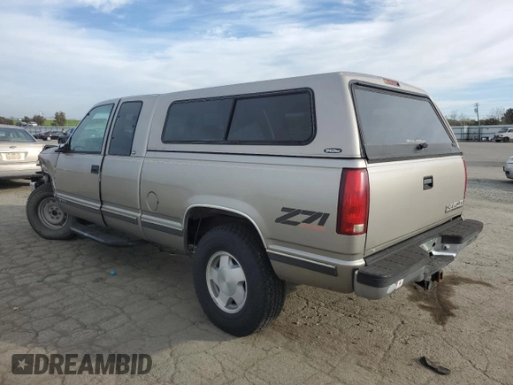 1998 Chevrolet Silverado 1500 with VIN 1GCEK19R1WE171942, listed as a Copart auction lot 46476505 with 219,527 mi miles and Salvage Title. Bid and sale history available at DreamBid. Image 2.