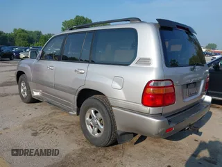 2001 Toyota Land Cruiser z VIN JTEHT05J912007249, wystawiony jako IAAI lot #42409963 z przebiegiem 303 292 mil mil oraz . Historia ofert i sprzedaży dostępna na DreamBid. Obrazek 3.