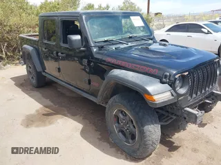 2022 Jeep Gladiator Rubicon z VIN 1C6JJTBM3NL165377, wystawiony jako IAAI lot #42020584 z przebiegiem 87 433 mil mil oraz . Historia ofert i sprzedaży dostępna na DreamBid. Obrazek 1.