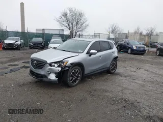 2016 Mazda CX-5 Grand Touring with VIN JM3KE4DY4G0712465, listed as a IAAI auction lot 41859217 with 61,806 mi miles and . Bid and sale history available at carsss.com. Image 18.