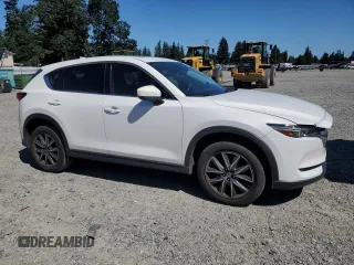 2018 Mazda CX-5 Grand Touring with VIN JM3KFBDM0J0419989, listed as a Copart auction lot 62868005 with 120,217 mi miles and Salvage title. Bid and sale history available at DreamBid. Image 4.