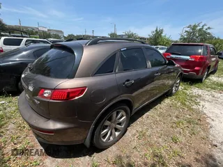 2003 Infiniti FX Options z VIN JNRAS08W93X205643, wystawiony jako Copart lot #58410885 z przebiegiem 210 110 mil mil oraz Tytuł czysty. Historia ofert i sprzedaży dostępna na DreamBid. Obrazek 4.