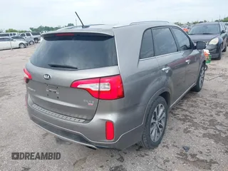 2014 Kia Sorento SX Limited with VIN 5XYKW4A73EG503792, listed as a IAAI auction lot 42684390 with 129,021 mi miles and . Bid and sale history available at DreamBid. Image 4.