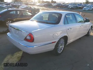 2007 Jaguar XJ with VIN SAJWA71B17SH12746, listed as a IAAI auction lot 41401422 with 99,735 mi miles. Bid and sale history available at carsss.com. Image 4.