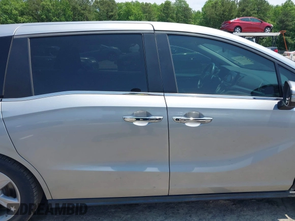 2019 Honda Odyssey EX-L z VIN 5FNRL6H72KB083499, wystawiony jako IAAI lot #42297110 z przebiegiem 81 747 mil mil oraz . Historia ofert i sprzedaży dostępna na DreamBid. Obrazek 14.