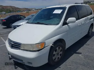 2003 Honda Odyssey EX-L z VIN 5FNRL18033B095684, wystawiony jako IAAI lot #42289617 z przebiegiem 174 336 mil mil oraz . Historia ofert i sprzedaży dostępna na DreamBid. Obrazek 6.